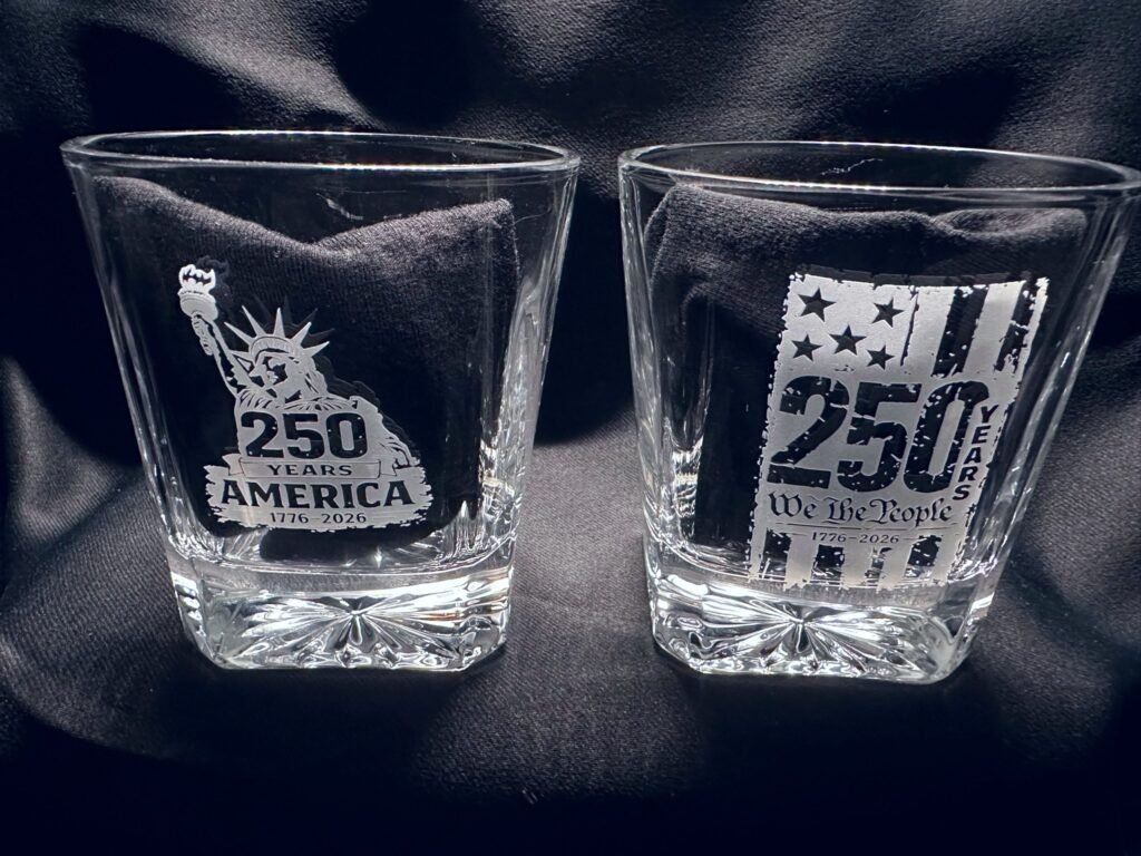 America 250 and tattered flag rocks glass pair